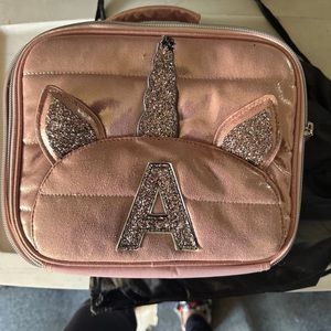 Unicorn initial a pink Justice lunchbox